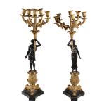A pair of gilt and patinated bronze six light figural candelabra in Restauration style, late 19th