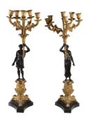 A pair of gilt and patinated bronze six light figural candelabra in Restauration style, late 19th