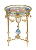A French Sevres style porcelain and gilt metal tripartite table, late 19th century, the circular top