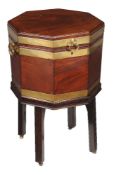 A George III mahogany and brass bound wine cooler, circa 1780, of octagonal form, the lid