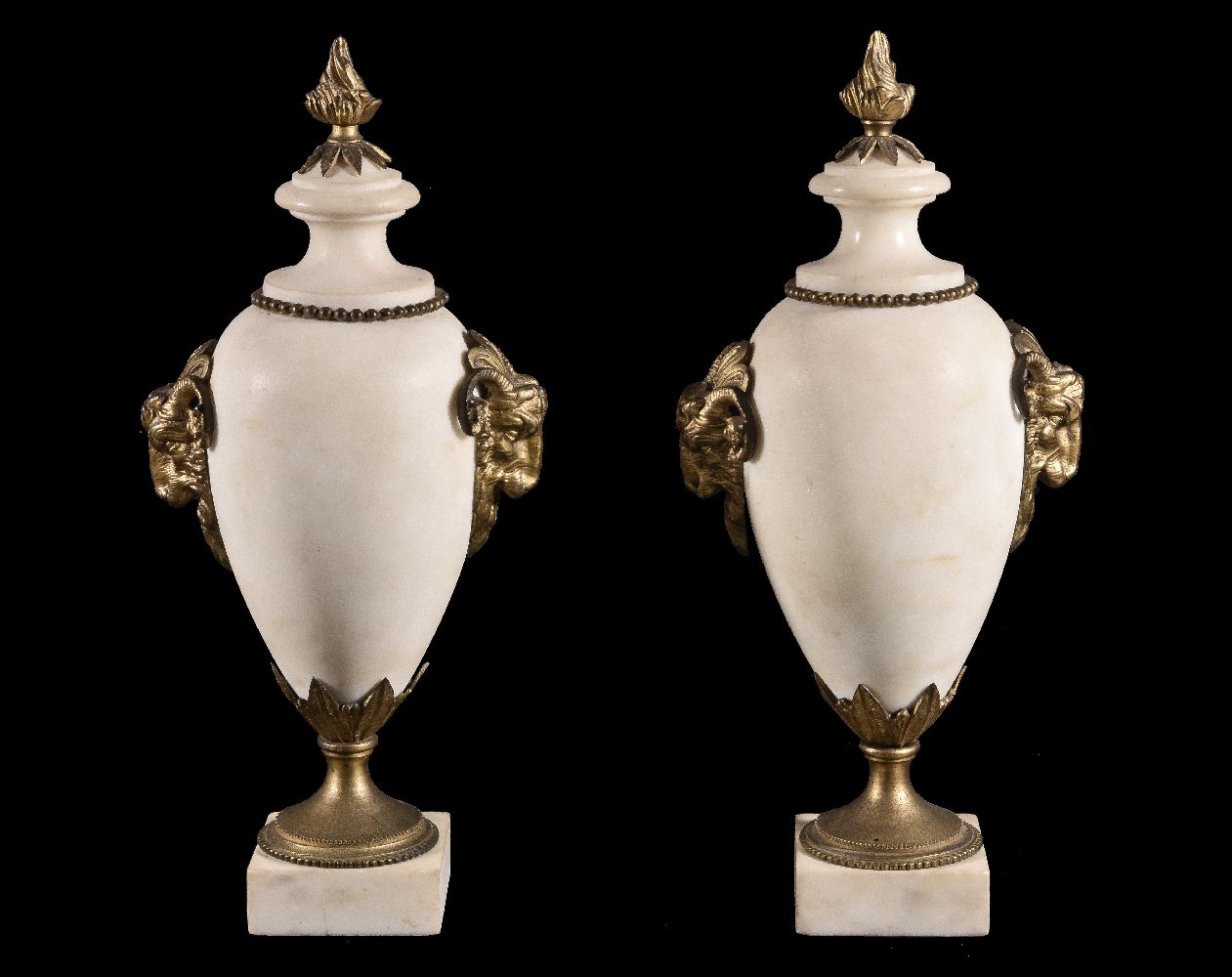 A pair of French white marble and gilt bronze mounted urns in Neoclassical style, circa 1875, with