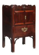 A George III mahogany tray top night commode, circa 1780, the rectangular top with shaped gallery