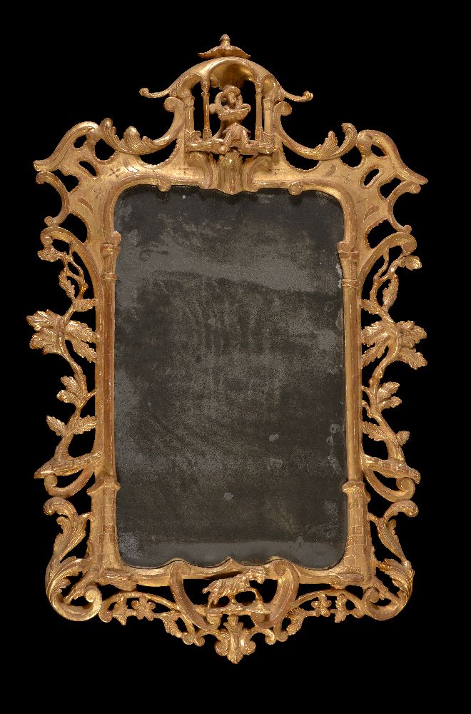 A pair of carved giltwood wall mirrors, late 18th/ early 19th century, each shaped rectangular plate