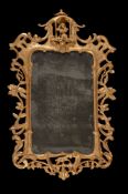 A pair of carved giltwood wall mirrors, late 18th/ early 19th century, each shaped rectangular plate