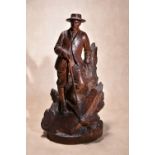 A Continental 'Black Forest' carved and stained wood model of a mountaineer, early 20th century,