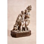 ϒ A fine Continental, probably German sculpted ivory Bacchic group, circa 1800