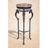 A Continental polished stone basin and bronze alloy tripod in the manner of antique atheniennes,