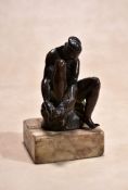 An Italo-Netherlandish bronze model of a seated female bather, circa 1600, portrayed with her