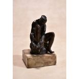 An Italo-Netherlandish bronze model of a seated female bather, circa 1600, portrayed with her