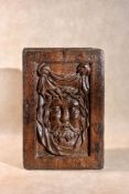 A sculpted oak panel depicting the face of Christ on the Veil of Saint Veronica, 16th century, of