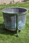 A substantial Victorian copper vat, later wrought iron mounted and utilised as a planter, second