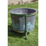 A substantial Victorian copper vat, later wrought iron mounted and utilised as a planter, second