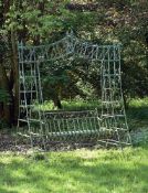 A painted wrought iron garden lovers' swing seat, late 20th century, the seat on suspension rods