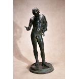 A Neapolitan patinated bronze model of Narcissus, cast after the Antique, late 19th century,