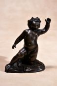 A Baroque bronze model of a putto, probably French, second half 17th century, portrayed nude and
