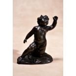 A Baroque bronze model of a putto, probably French, second half 17th century, portrayed nude and