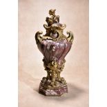 A sculpted brêche violette marble and gilt bronze mounted urn in Louis XV style, mid 19th century,