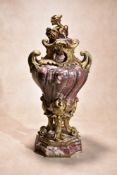 A sculpted brêche violette marble and gilt bronze mounted urn in Louis XV style, mid 19th century,