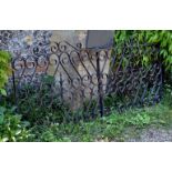 A pair of painted wrought iron gates, early 20th century, of rectangular form, with openwork