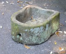 Two limestone basins, probably 18th century, of D-shaped section, the larger example 28cm high, 67cm