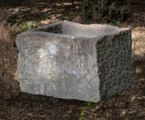 A substantial rough hewn red sandstone trough or planter, probably 18th century, of rectangular