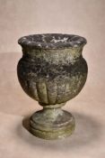 A carved white marble garden urn, circa 1800, the everted rim above Adam style swags in relief to