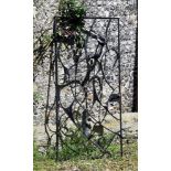 A painted wrought iron gate, second quarter 20th century, of rectangular openwork form, the