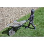 A bronze alloy garden water fount modelled as a boy with a wheelbarrow, second half 20th century,