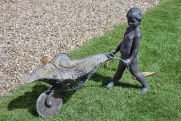 A bronze alloy garden water fount modelled as a boy with a wheelbarrow, second half 20th century,