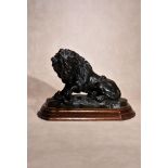 A patinated bronze group of a lion and a serpent, in the manner of examples by Antoine-Louis