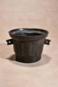 An English or Dutch bronze mortar, 17th century, of circular section and tapering form, the flared