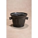 An English or Dutch bronze mortar, 17th century, of circular section and tapering form, the flared