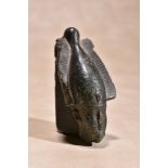 An Egyptian sculpted steatite fragment of the head of Osiris, Late Period to Ptolemaic, circa