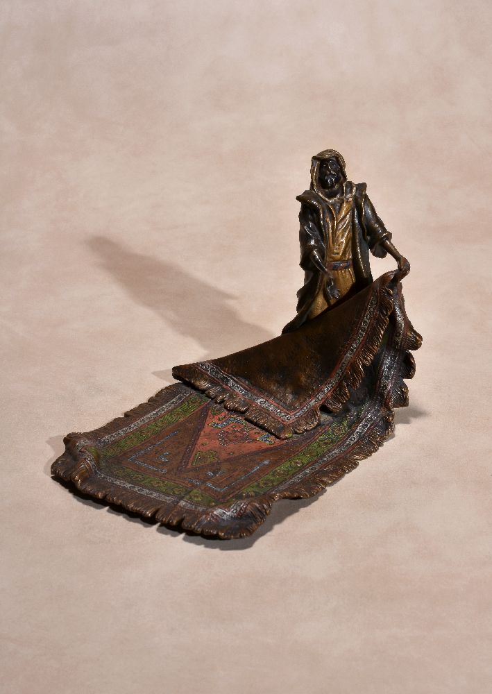 An Austrian cold painted bronze model of a Levantine carpet seller, circa 1900, by Bergman of