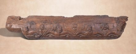 A substantial Mediaeval carved oak transom beam, probably English, 14th/ 15th century, the frieze