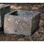 A substantial rough hewn red sandstone trough or planter, probably 18th century, of rectangular