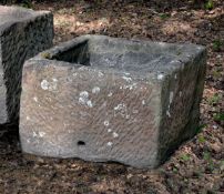 A substantial rough hewn red sandstone trough or planter, probably 18th century, of rectangular