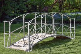 A painted wrought iron bridge in Regency taste, modern, the sides with strapwork arcading above wood