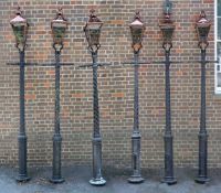 A set of six cast and painted aluminium lampposts, late 20th century, each with glazed copper