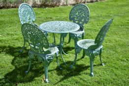 A painted cast iron garden table and four chairs en suite, mid 20th century, with openwork foliate