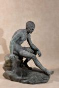 An Italian verdigris patinated bronze and green serpentine marble mounted model of the Seated