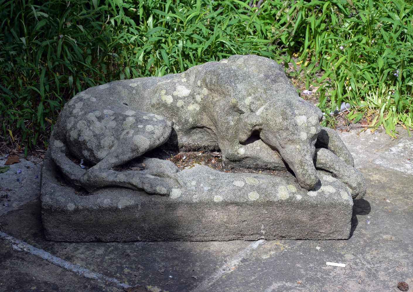 A stone composition model of a hound, early 20th century, modelled recumbent, on an integral - Image 2 of 2