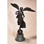 An Italian patinated bronze and marble mounted Grand Tour model of Nike, the winged Victory,