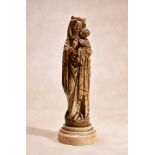 ϒ A French Gothic sculpted ivory group of the Madonna and Child, late 15th century, the Virgin