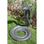 A sculpted stone model of a cobra, second half 20th century, portrayed rising from its coiled body