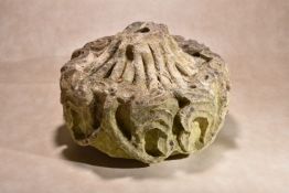 A Mediaeval sculpted limestone ceiling boss, probably French, 15th century, of drum form, with