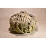 A Mediaeval sculpted limestone ceiling boss, probably French, 15th century, of drum form, with