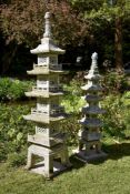 Two similar Oriental carved granite garden pagodas, 20th century, the larger example with four