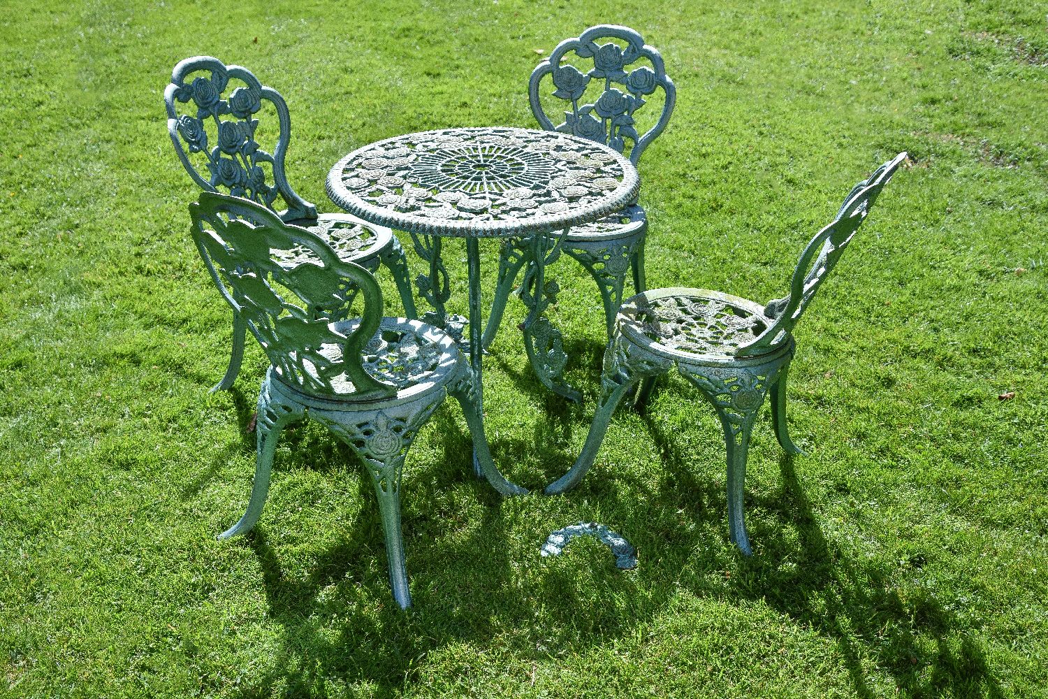 A pair of painted cast iron garden tables and two sets of four chairs en suite, mid 20th century, - Image 3 of 3