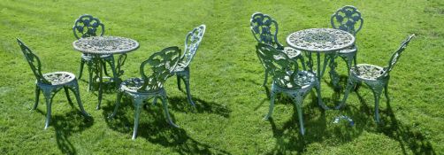 A pair of painted cast iron garden tables and two sets of four chairs en suite, mid 20th century,